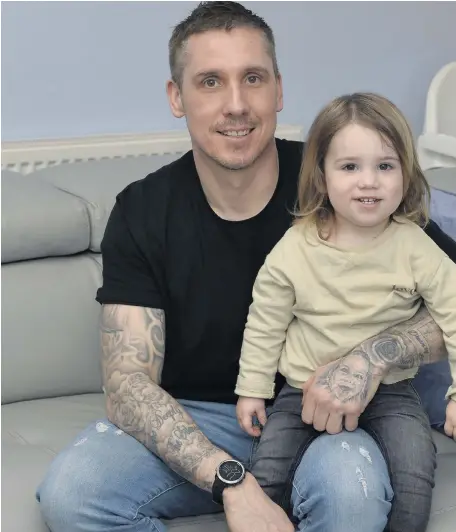  ?? STEPHEN HAMILTON ?? Everlastin­g honour: Craig Mayne with Teddy sports tattoos for his children on his left arm. Below, the tattoo in memory of his late dad Jim