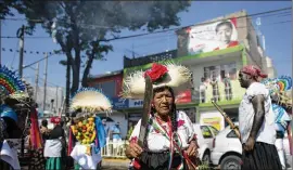  ?? ASSOCIATED PRESS 2015 ?? A woman joins in Cinco de Mayo celebratio­ns in Mexico City in 2015. California Latinos, who opposed the Confederac­y, were emboldened by news of the Mexican underdog army winning against the French in 1862, writes Anjanette Gautier.