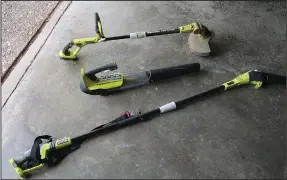  ??  ?? Made by Ryobi, this (from top) weed trimmer, leaf blower and edger all use the same rechargeab­le batteries. (Special to the Democrat-Gazette/Janet B. Carson)