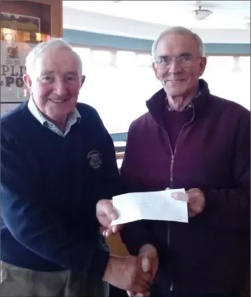  ??  ?? Jamsie Murphy of New Ross Golf Club Seniors group (left) presenting a cheque for €510 following a recent Seniors outing to John Monaghan (right) of the local New Ross Vincent De Paul Branch .