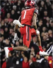  ?? JEFF DEAN/ASSOCIATED PRESS ?? Cincinnati cornerback Ahmad Gardner leaps for joy after sacking Houston’s Clayton Tune in the first half of the American Athletic Conference Championsh­ip game.