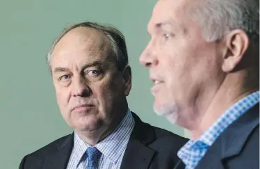  ??  ?? B.C. Green Leader Andrew Weaver and B.C. NDP Leader John Horgan announce a coalition on June 14.