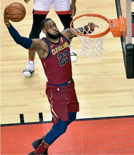  ?? AP ?? LeBron James, in his usual Cavalier fashion, dunks another basket against the Toronto Raptors in game one of their Eastern Conference semifinal.