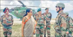  ?? PTI ?? ▪ Defence minister Nirmala Sitharaman with Army chief General Bipin Rawat (third from left) interacts with troops on their visit to the Balbir forward post in Keran sector, J&amp;K on Sunday.