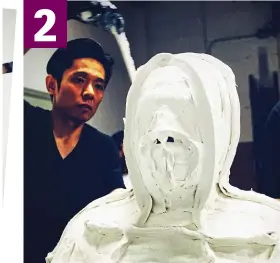  ??  ?? Shaping up: Special effects genius Tsuji then covers the mould with a plaster compound to create a bust