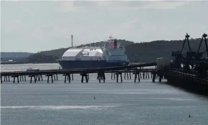  ?? Photograph: Dan Peled/AAP ?? LNG tanker at Gladstone Port: Study finds more than $1.5bn in finance went to fossil fuel projects such as Santos’s LNG project in Gladstone.
