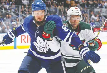  ?? CLAUS ANDERSEN/GETTY IMAGES ?? The Leafs have won three straight despite missing three of their top four defenceman, including Jake Muzzin, left. A patchwork crew cobbled together from the minors has held down the fort.