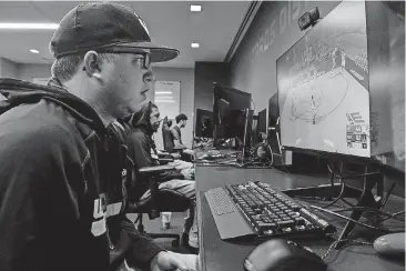  ?? [PHOTO BY RICKY CARIOTI, WASHINGTON POST] ?? Boo Painter, 24, works on his skills as profession­al video gamer for Wizards District Gaming.