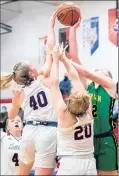  ?? KYLE TELECHAN/POST-TRIBUNE ?? South Central’s Olivia Marks (40) and Delanie Gale (20) try to block the shot of Morgan Township’s Peyton Honchar during a game on on Monday.