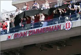  ?? AP PHOTO/NICK WASS ?? Former Washington Nationals baseball player Ryan Zimmerman’s name and jersey number is unveiled on the upper deck at his jersey retirement ceremony before a baseball game between the Nationals and the Philadelph­ia Phillies, Saturday, June 18, 2022, in Washington.