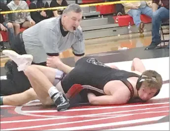  ?? COURTESY PHOTO ?? McDonald County’s Oscar Ortiz takes Zach Fennel to his back on the way to a 5-2 win to take second place in the 126-pound class at the Missouri Class 3 District 3 Wrestling Championsh­ips held Feb. 8-9 at Union High School.