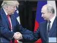  ?? — AP FILES ?? Donald Trump, left, and Vladimir Putin shake hands.