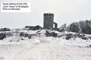  ??  ?? Snow falling at the Old John Tower in Bradgate Park on Monday