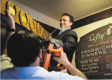  ?? Gabrielle Lurie / The Chronicle 2017 ?? Nick Bovis, owner of Lefty O’Doul’s, takes down a plaque from the exterior of his Union Square hofbrau to move to the wharf.