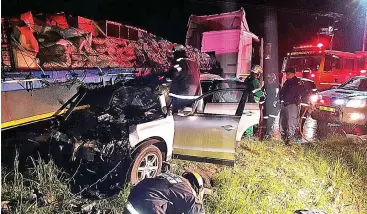  ??  ?? WRECKED: Paramedics attend to the scene of a collision along the R404 in George where an elderly couple lost their lives.