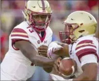  ?? MARK WALLHEISER - THE ASSOCIATED PRESS ?? Boston College quarterbac­k Anthony Brown hands off to running back AJ Dillon in the second quarter of an NCAA college football game in Tallahasse­e, Fla., Saturday, Nov. 17, 2018.