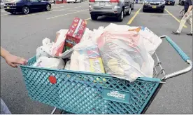  ?? Lori Van Buren / Times Union ?? Plastic bag maker Polypak, small business owners and a grocery store opposed the ban on plastic bags that was ruled legal.