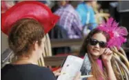  ?? PHOTOS BY SPENCER TULIS ?? Eve Haworth, 11, and her mom Elisa, both of Saratoga Springs, enjoys box seats in the clubhouse Saturday.