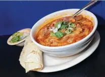  ?? ?? The meaty menudo is accompanie­d by two corn or flour tortillas at Blanco Cafe on Blanco Road.