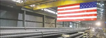  ?? JIM MONE/AP ?? Steel rods produced at the Gerdau Ameristeel mill in St. Paul, Minnesota, await shipment. President Donald Trump has imposed tariffs on imported steel.