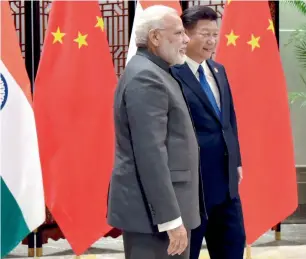  ?? PTI ?? Narendra Modi and Xi Jinping on the sidelines of the 9th BRICS Summit in Xiamen on Tuesday. —
