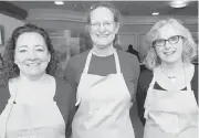  ??  ?? Volunteers, from left, Dana Tremblay, Ruth McAllister and Vicki Ziegler