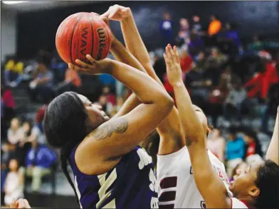  ?? Terrance Armstard/News-Times ?? Tough shot: Junction City's Jada Archie (33), left, shoots above Fordyce's Alyssa Brown (33) and Lamya Bulliner (24) during first-half action of the championsh­ip game of the 8-3A District Tournament on Friday night.