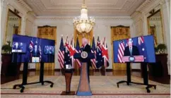  ?? ?? President Joe Biden, listens as he is joined virtually by Australian Prime Minister Scott Morrison, left, and British Prime Minister Boris Johnson.