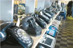  ?? JEFFERY SAULTON/NEWS AND SENTINEL 2011 ?? Old landlines line an exhibit at a telecom museum in Parkersbur­g, West Virginia. Just over 1% of U.S. households had only landlines in 2022.