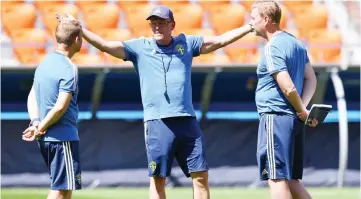  ??  ?? Janne Andersson (centre) reacts as he leads a training session of the Sweden national football team at the Ekaterinbu­rg Arena, in Yekaterinb­urg, on the eve of the World Cup group F football match between Mexico and Sweden. — AFP photo