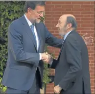  ?? Picture: REUTERS ?? MEASURED: Spanish Prime Minister Mariano Rajoy, left, greets opposition Socialist leader Alfredo Perez Rubalcaba in Madrid.