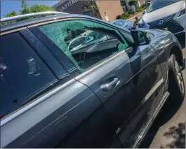  ?? Courtesy photo ?? A parked car had its window shattered outside of a local LA Fitness. A man and a woman are facing felony and misdemeano­r criminal charges in connection with the thefts at the Santa Clarita Valley gyms.