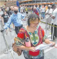  ??  ?? Danetia Howard looks over her ballot in North Las Vegas.