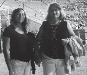  ?? ?? Gem Madhoo-Nascimento poses with her sister after seeing “Trojan Women” at Epidaurus Amphitheat­er in Greece in 2013