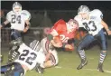  ?? MORNING CALL ?? Parkland’s Matt Thomas is brought down by Dieruff’s Jason Bonilla (22) as the Huskies’ Matt Marcks (83) and Jason Witt close in during a game in 1997.