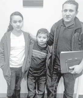  ?? Lomi Kriel / Houston Chronicle ?? Jose Menjivar brought his children Sandy, 11, and Steven, 7, to the U.S. after gangs followed him to Steven’s school in their home country of El Salvador. Bringing them on the perilous trip was, Menjivar said, “the worst experience in my life.”