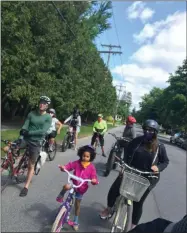  ?? PHOTO PROVIDED ?? Slow Roll participan­ts ride their bikes through Saratoga Springs during an event in 2020.