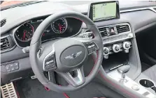  ??  ?? The G70’s interior features first-class materials and intuitive design.