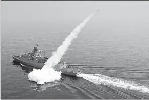  ?? AP/South Korea Defense Ministry ?? A South Korean ship fires a missile during a drill Thursday in the East Sea. South Korean warplanes and navy ships have fired a barrage of missiles into the waters during one-day drills aimed at boosting readiness against possible North Korean...