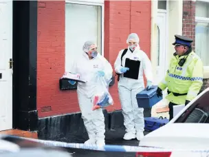  ??  ?? ●●Police officers outside the house on Clement Royds Street where Rahman Begum’s body was found