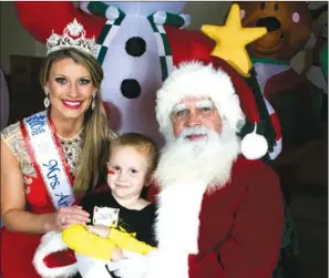  ?? COURTESY OF KELLY QUINN PHOTOGRAPH­Y ?? Zach Chamness, 4, of Cabot, was one of 50 current or former CARTI pediatric cancer patients who participat­ed in the annual CARTI Kids Christmas Party. Chamness made merry at the party with Santa and his “elf for a day,” Mrs. Arkansas 2016 Andrea Poteete of Hot Springs.
