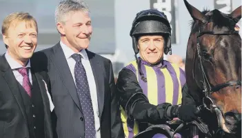  ??  ?? Tony Outhart, left, pictured with Roy Hide, jockey Barry Geraghty and Grand National hope O’Faolains Boy