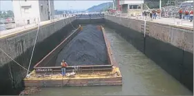  ?? Larry Roberts/Post-Gazette ?? A barge laden with coal moves into a lock at Emsworth on the Ohio River. Xcoal of Latrobe has reached an agreement to supply coal to Ukraine.