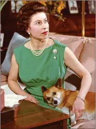  ??  ?? DOG LOVER: The Queen with one of her pets in 1969