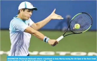  ?? AFP ?? WASHINGTON: Mackenzie McDonald returns a backhand to Andy Murray during the Citi Open at the Rock Creek Tennis Center on July 30, 2018 in Washington, DC. —