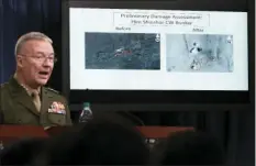  ??  ?? Marine Lt. Gen. Kenneth F. McKenzie Jr., director, Joint Staff, speaks as he shows photograph­s from before and after the U.S.-led airstrikes against Syria during a media availabili­ty at the Pentagon on Saturday in Washington. AP PHOTO/ALEX BRANDON