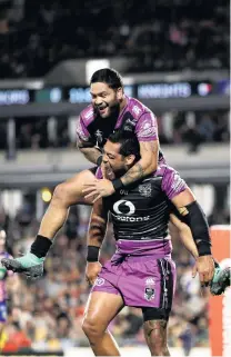  ?? PHOTO: GETTY IMAGES ?? Try that . . . Warriors forward Adam Blair is congratula­ted on his try and leapt upon by teammate Issac Luke during their NRL match against the Newcastle Knights in Auckland last night.