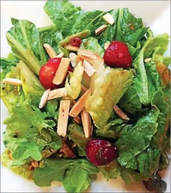  ?? PHOTO COURTESY OF BRENDA KIEFFER ?? Strawberri­es and almonds top this “berry, berry good salad.”