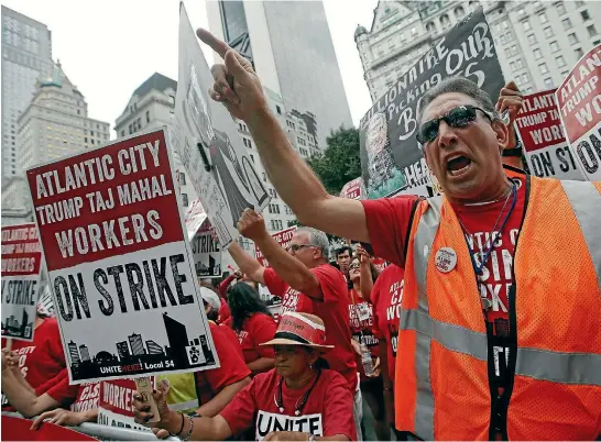  ?? REUTERS ?? Trump Taj Mahal workers went on strike after their benefits were scrapped when Donald Trump’s friend, billionair­e investor Carl Icahn, bought the casino out of bankruptcy this year.