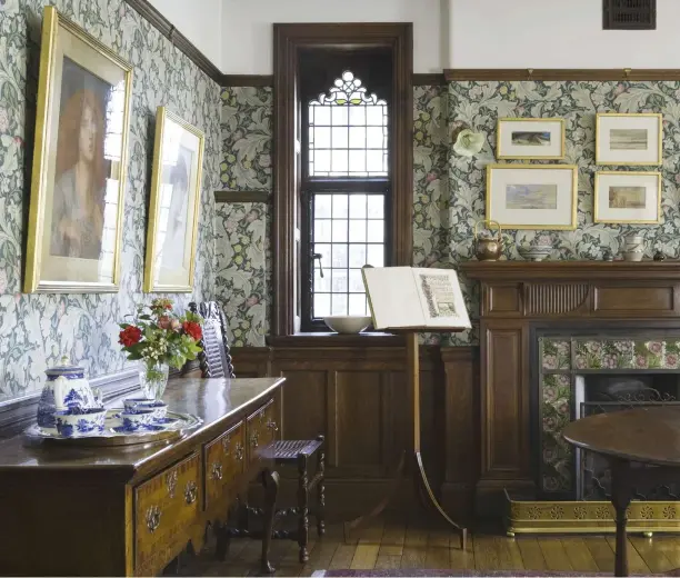  ??  ?? ABOVE The Morning Room, hung with Morris & Co ‘Leicester’ wallpaper, has variously served as a sitting room, dining and breakfast room. The replace is lined with De Morgan rose tiles. Drawings by Rossetti hang above the sideboard FACING PAGE, TOP The...